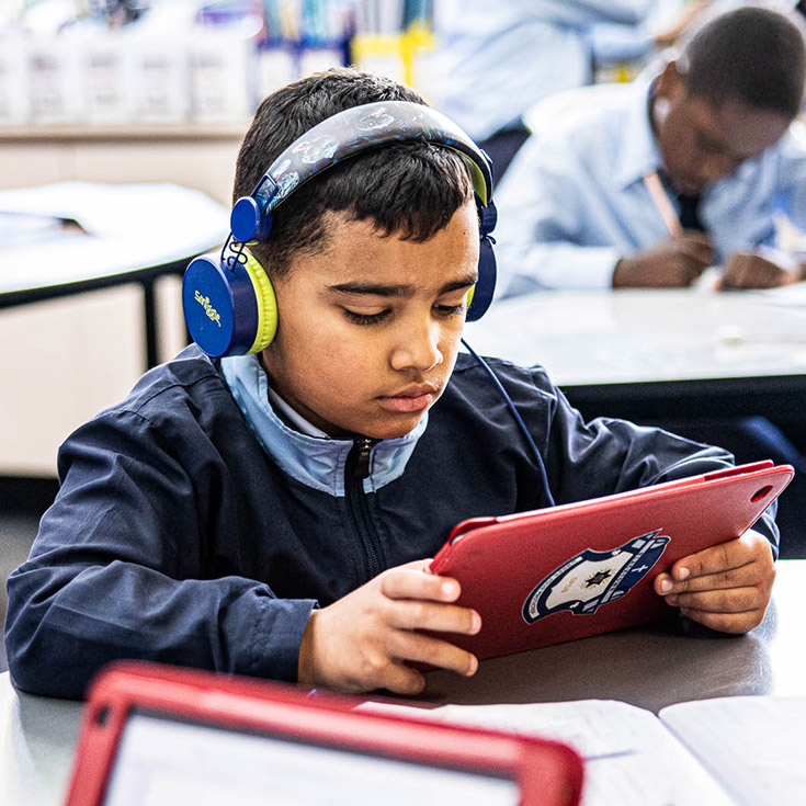 Boy learning with iPad at St Patrick's Catholic Primary Blacktown